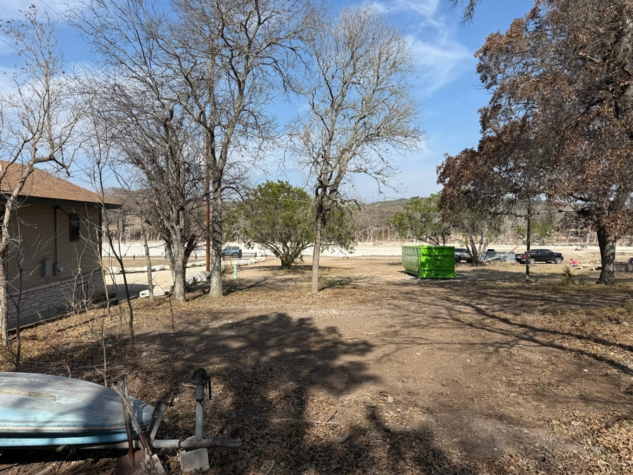 Cleared land post structure demolition at 470 Cade Loop
