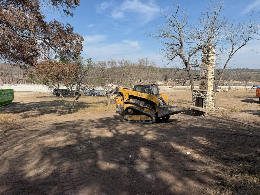 Land clearing after structure demolition at 470 Cade Loop