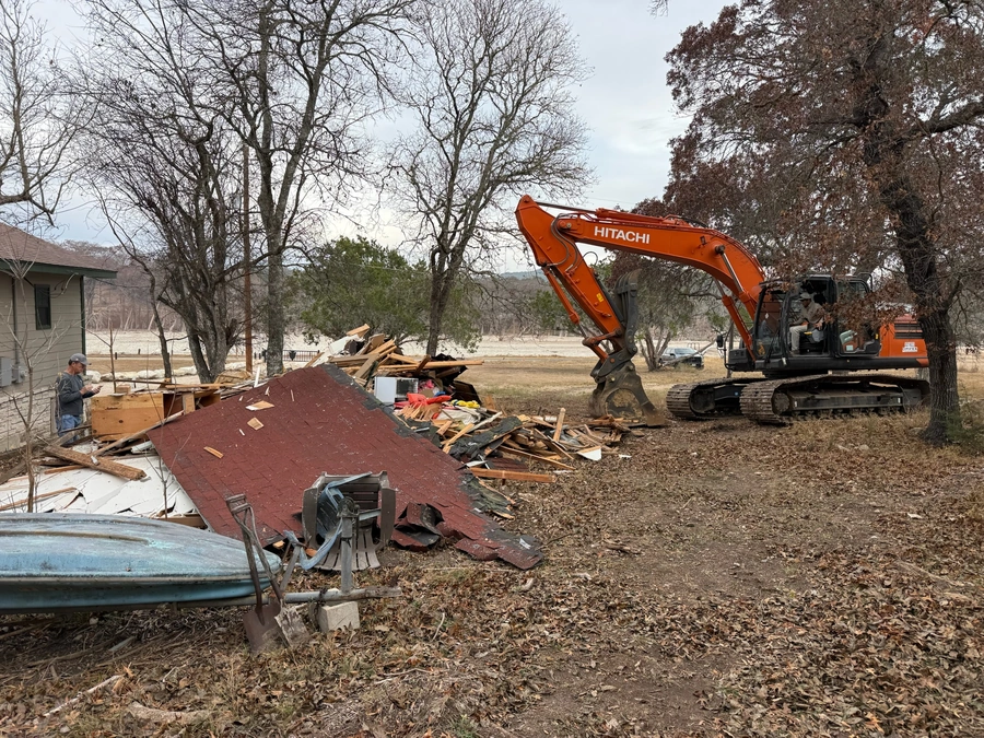 Structure demolition in action at 470 Cade Loop