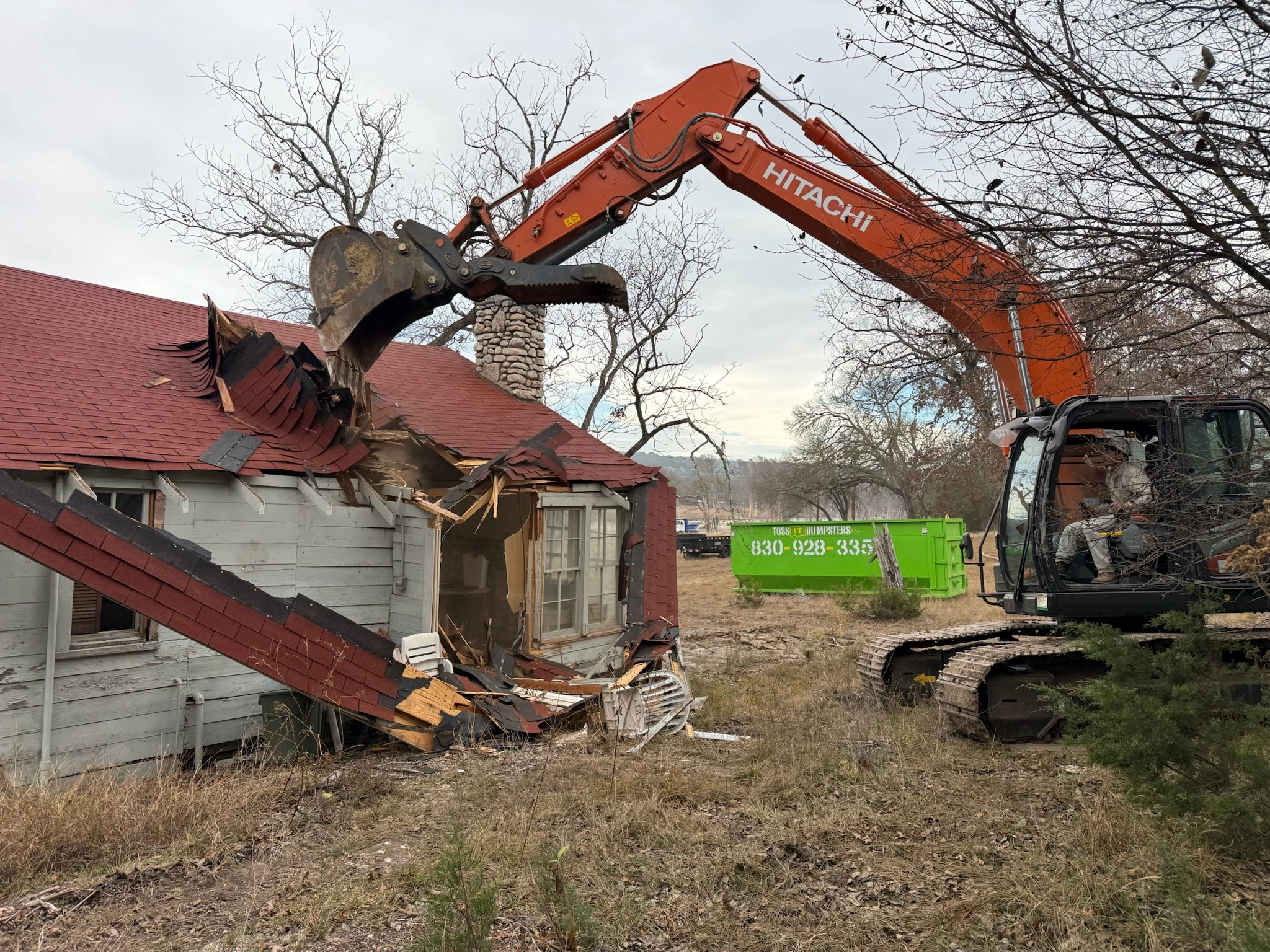 Structure demolition in action at 470 Cade Loop