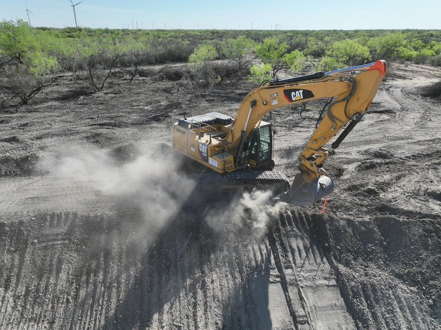 CAT 336 excavator performing precise excavation work