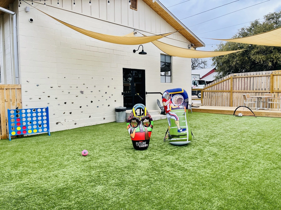 Blanco Feed Store outdoor space with yard games