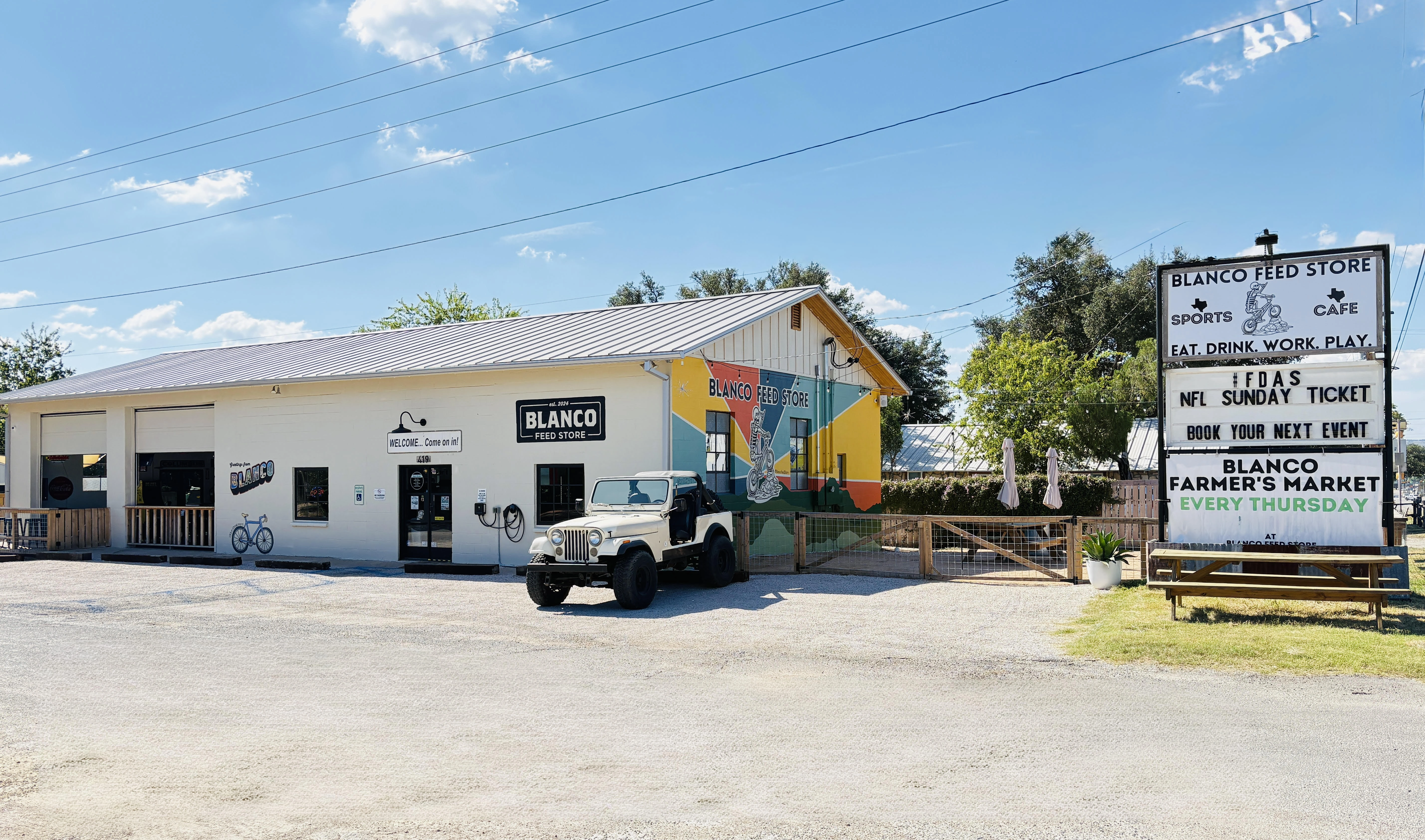 The front of the Blano Feed Store on a sunny day