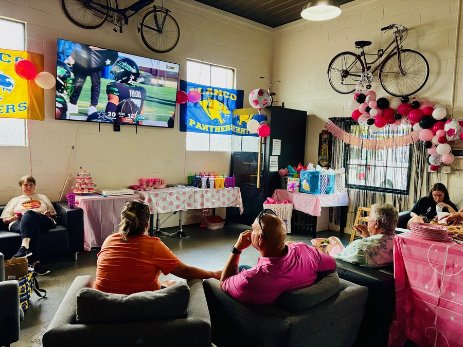Blanco Feed Store patrons watching the Seahawks