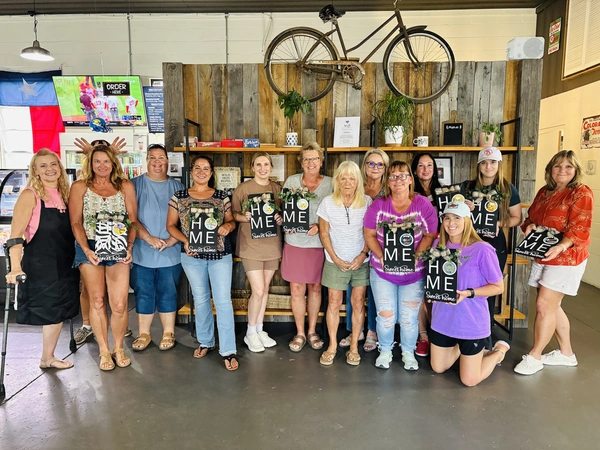Painting Class Participants showing their final products