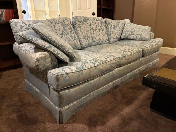 Antique blue and white couch available in the December 2025 estate sale in Austin TX