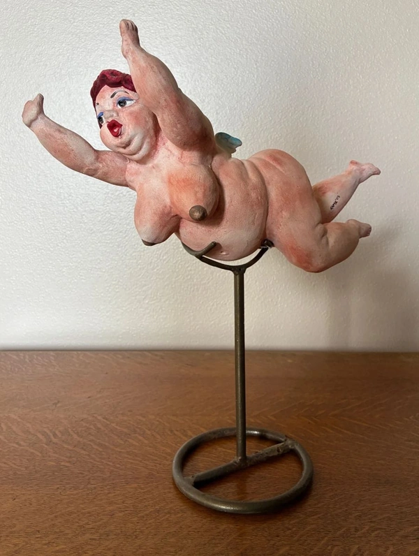 Flying nude woman stature item from estate sale