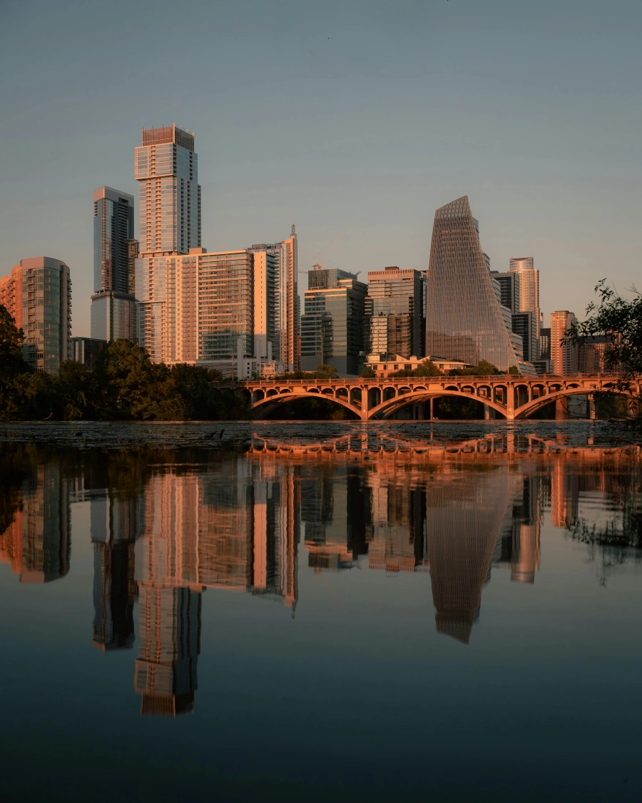 Stunning downtown Austin skyline reflected in Lady Bird Lake during golden hour