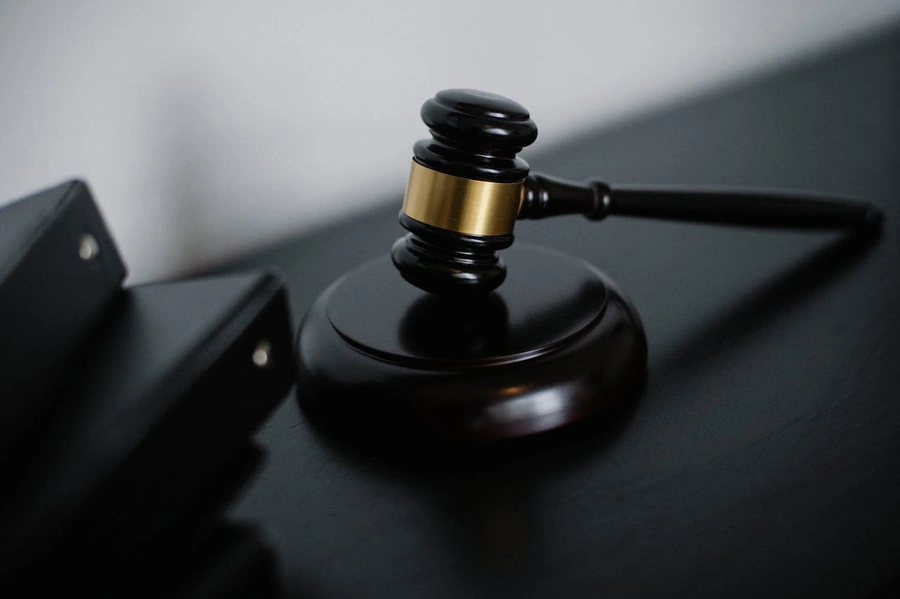 A gavel hitting a sound block