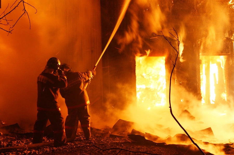 Firefighters putting out a house fire