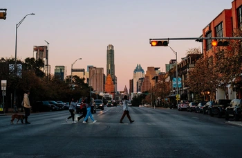 Pedestrians walking across the street in downtown Austin