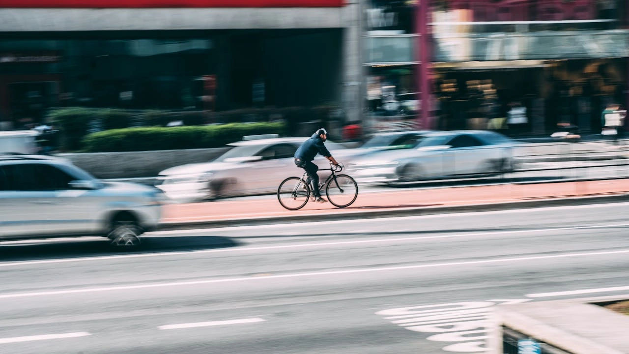 Cyclist in the city with traffic