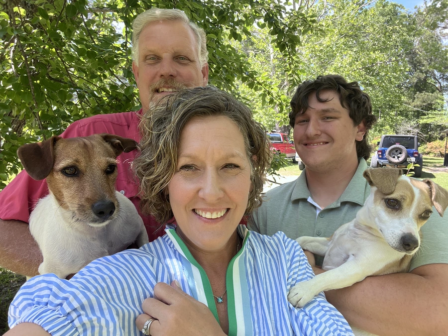 Family Care Inc COO Monti Montgomery with her family and adorable dogs