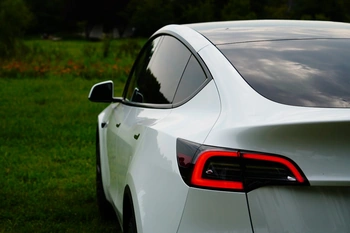 Photo of tesla from back and side of the car