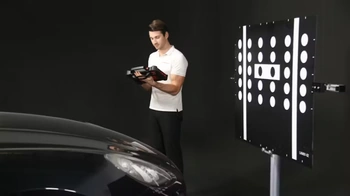 Technician performing ADAS calibration