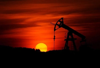 Oil pumpjack at sunset representing North Dakota mineral interests