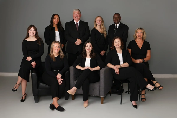 Professional team photo of the Maverick Law Group dressed in formal business suits  