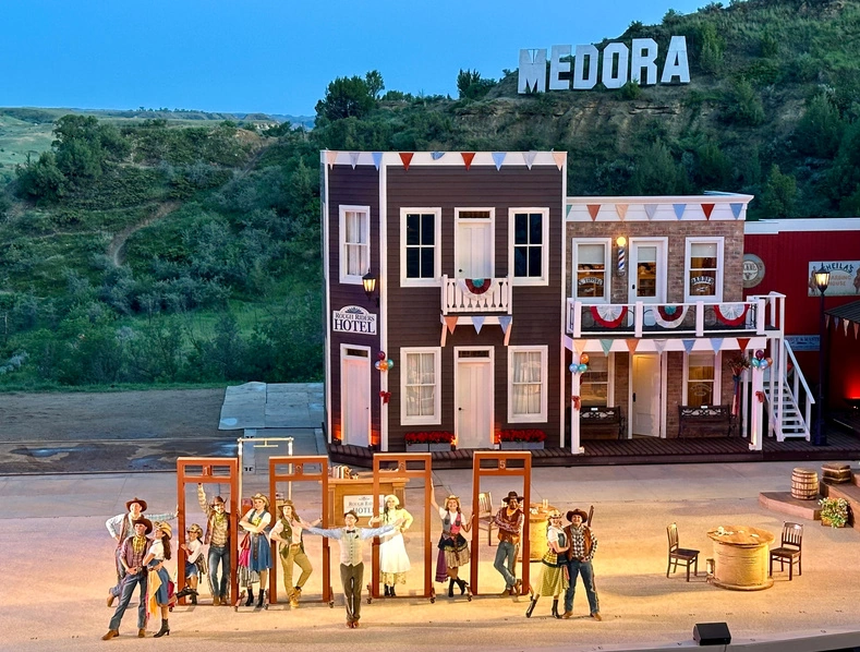 The Medora Musical stage beneath the MEDORA hillside sign