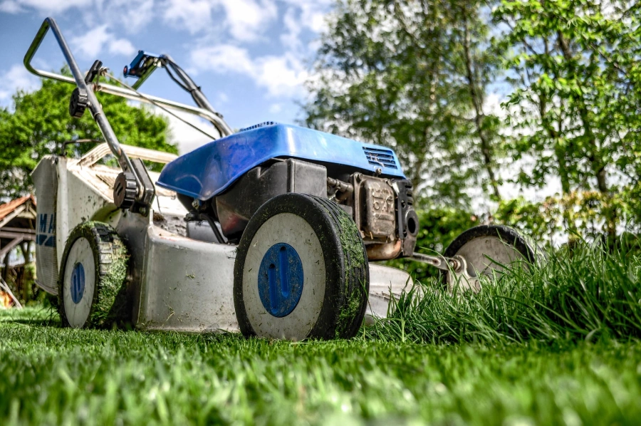 Professional lawn mower on freshly cut grass