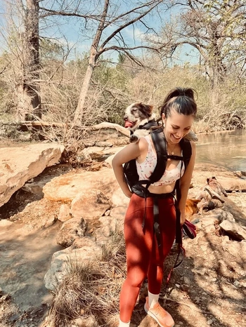 Ana hiking with her dog 