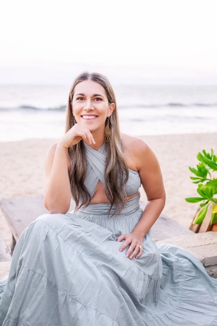 Photo of Ana Rodriguez in a dress on a beach