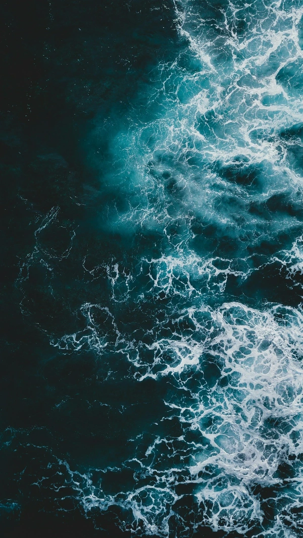 Photo of ocean after waves have crashed