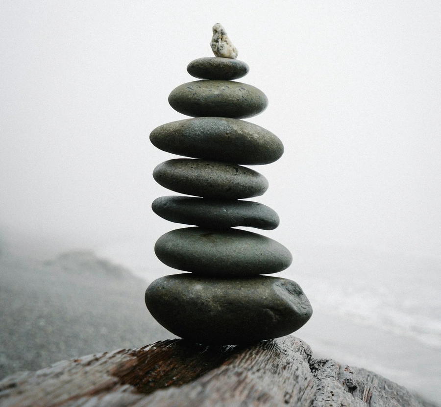 Stack of rocks balancing on mountain top