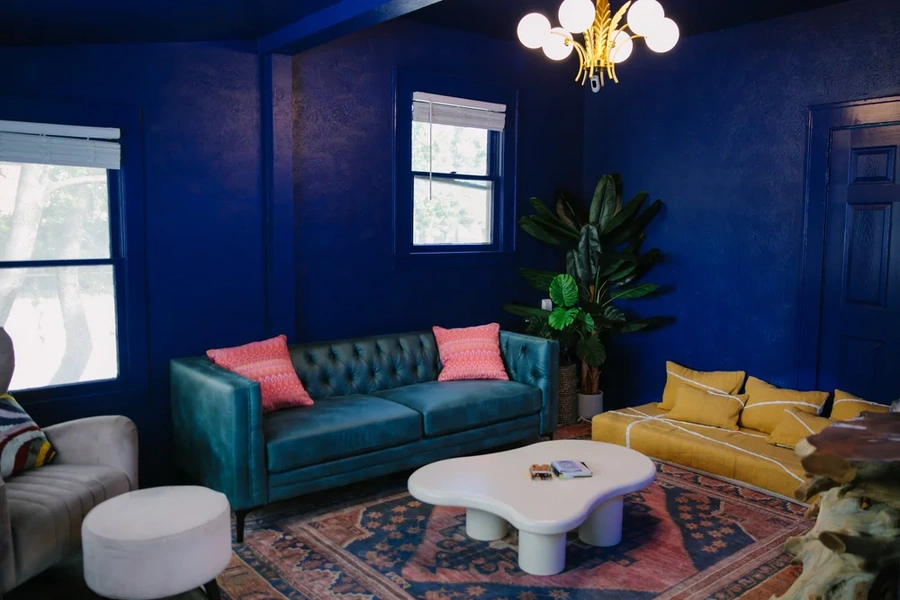 Purple therapy room with green couch