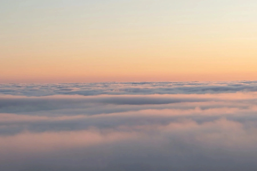 Dusk over the clouds