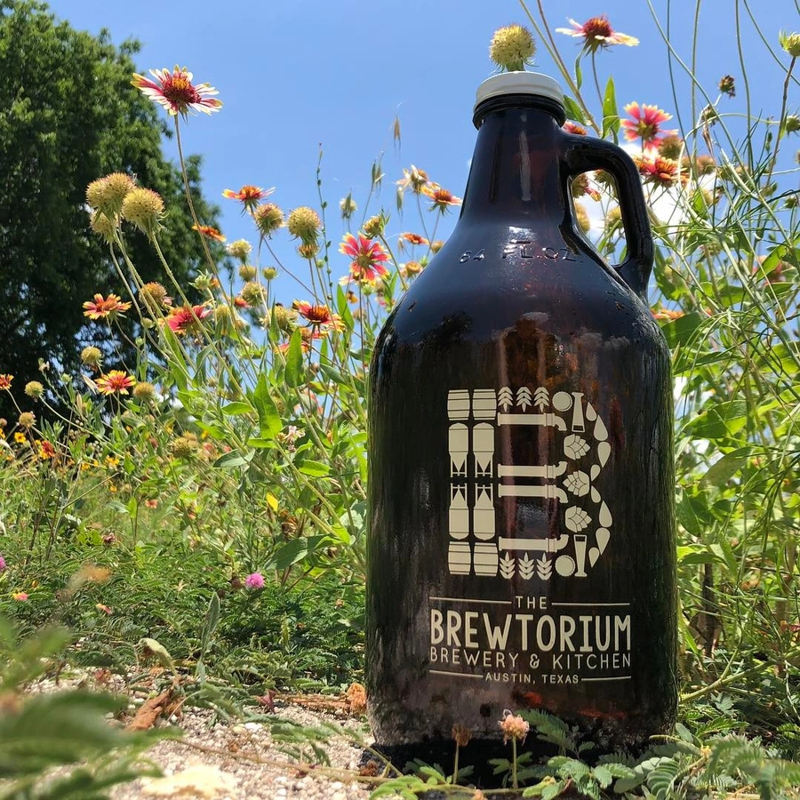 Brewtorium growler filled with fresh craft beer, perfect for taking your favorite brew home