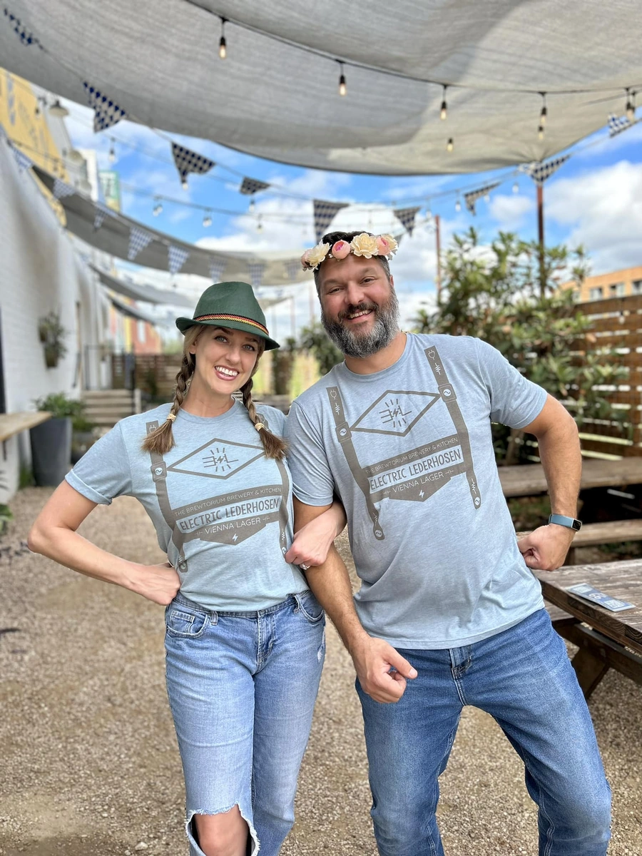 Brewtorium owners celebrating Brewtoberfest in traditional German attire, showcasing our commitment to authentic German beer culture