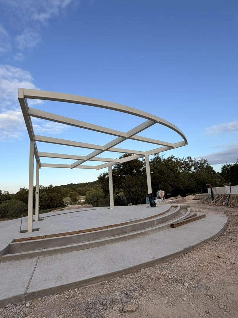 Completed curved steel canopy frame over the Garey Park pavilion stage