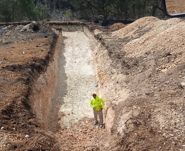 Photo of True CSC employee performing earthwork services 