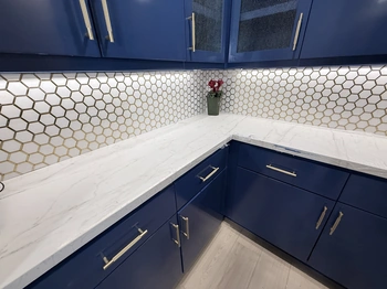 White kitchen countertop with white honeycomb backsplash 