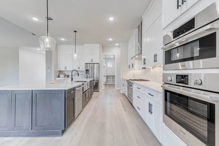 Kitchen flooring and backsplash installed by Victory Surfaces