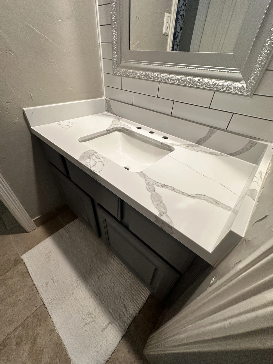Secondary bathroom countertop and backsplash 