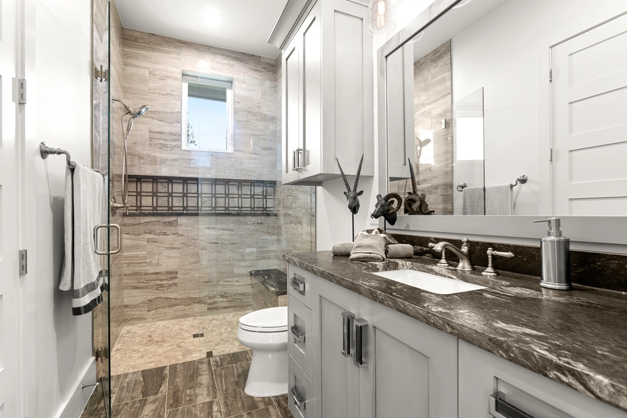 Elegant guest bathroom at 1534 Circolare with decorative tile work, floating vanity, and designer fixtures