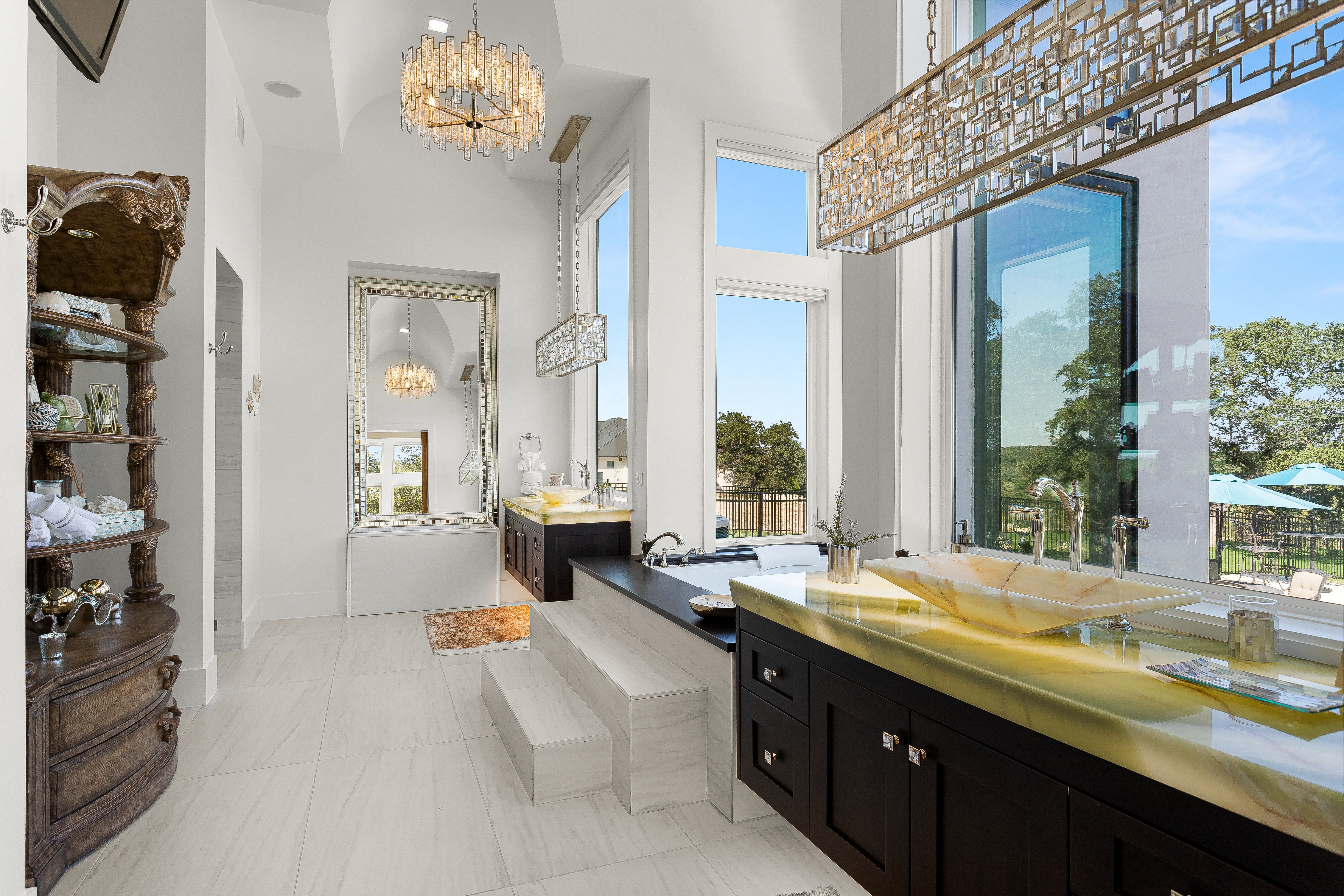 Luxurious master bathroom at 1534 Circolare with freestanding soaking tub, dual vanities, and elegant stone finishes