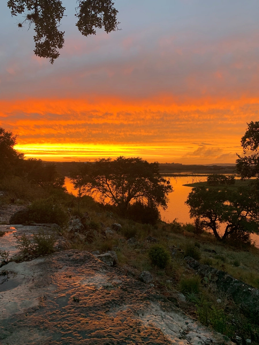 View of sunset over lake at Cordova Bend