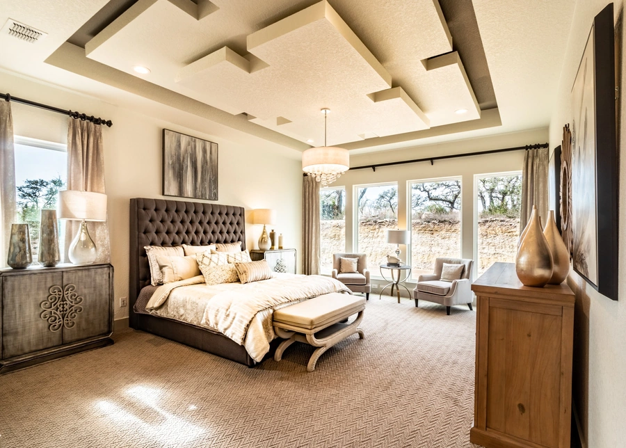 Fully furnished primary bedroom built by Vintage Luxury Builders