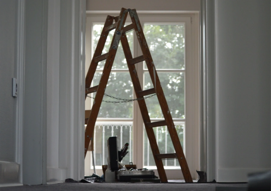 Professional contractor reviewing building plans with client