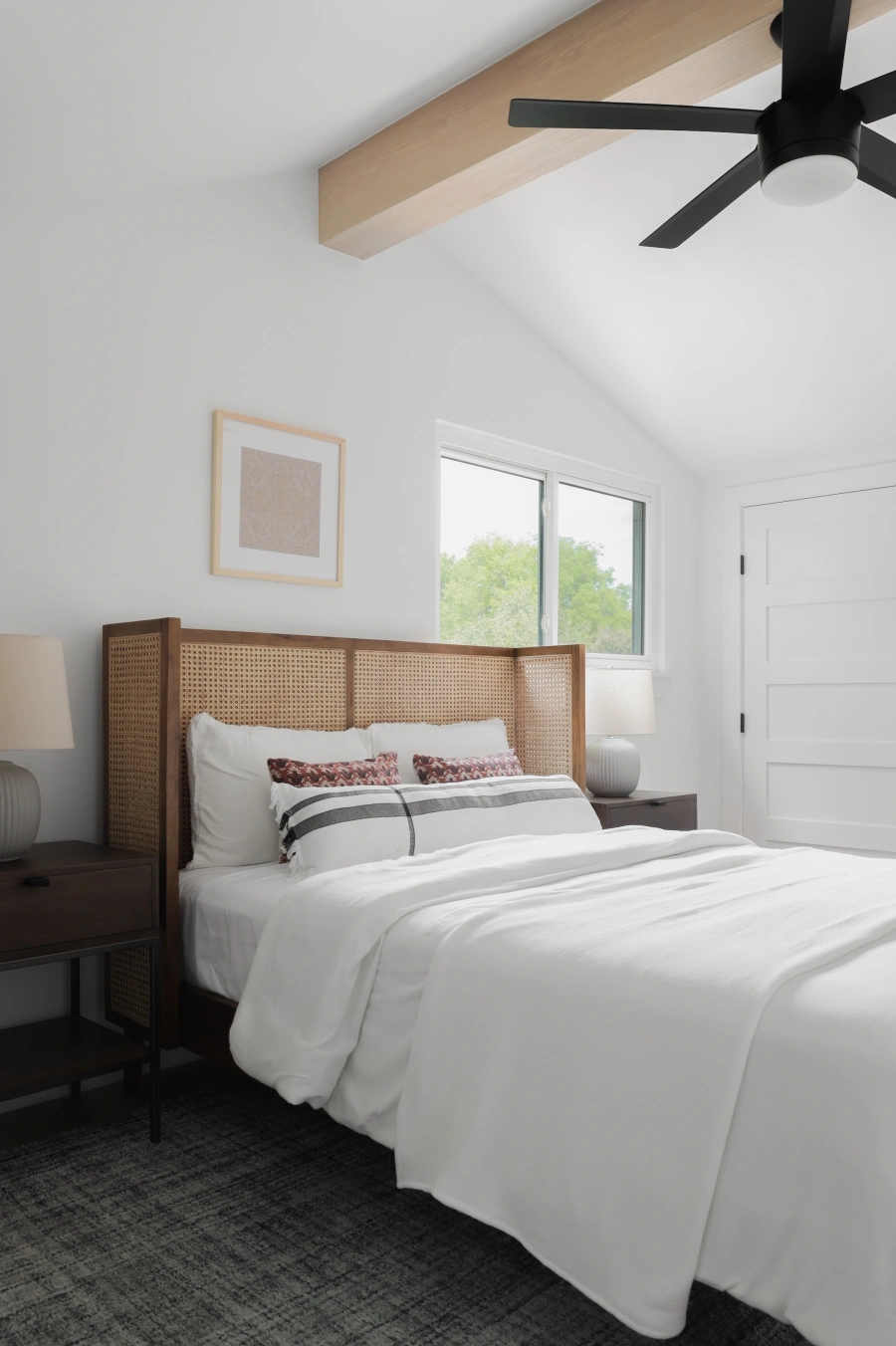 Modern bedroom with wood headboard and natural light