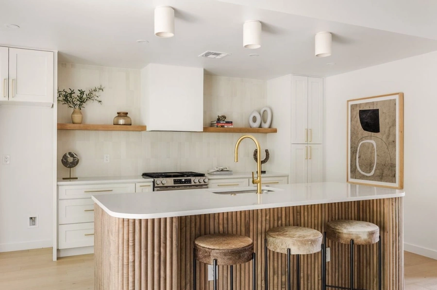 Modern kitchen with curved fluted wood island