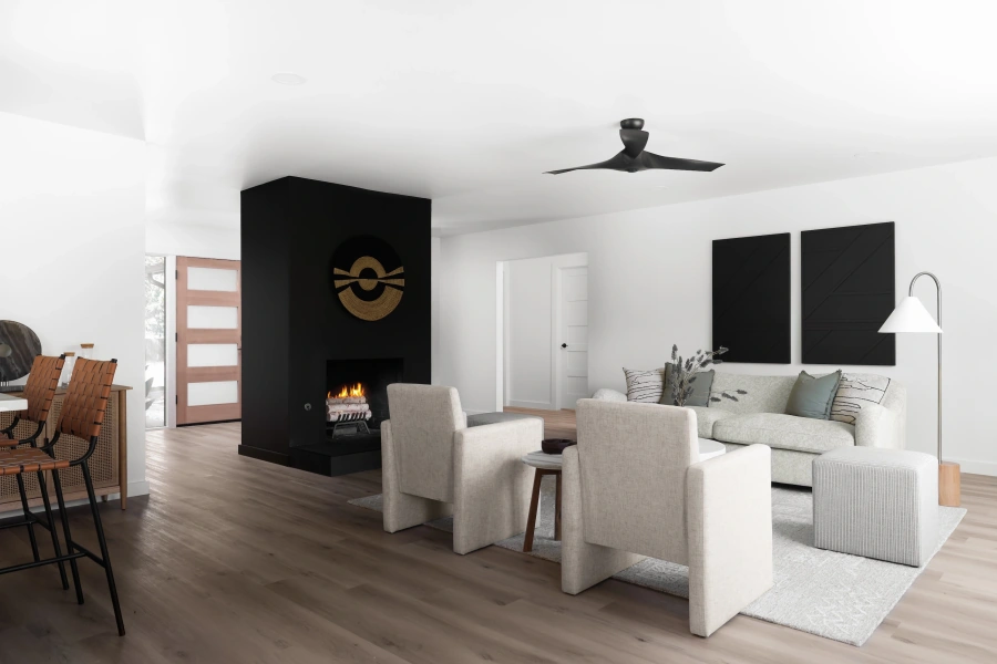 Modern living room with black accent wall and fireplace