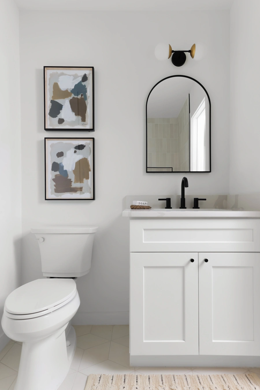 Sterling Hill Bathroom Remodel - Modern bathroom with arched mirror and white vanity