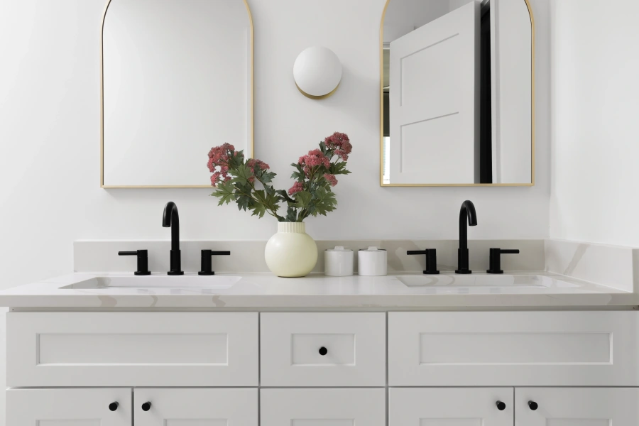 Laefield Bathroom Remodel -Modern double vanity bathroom with brass accents