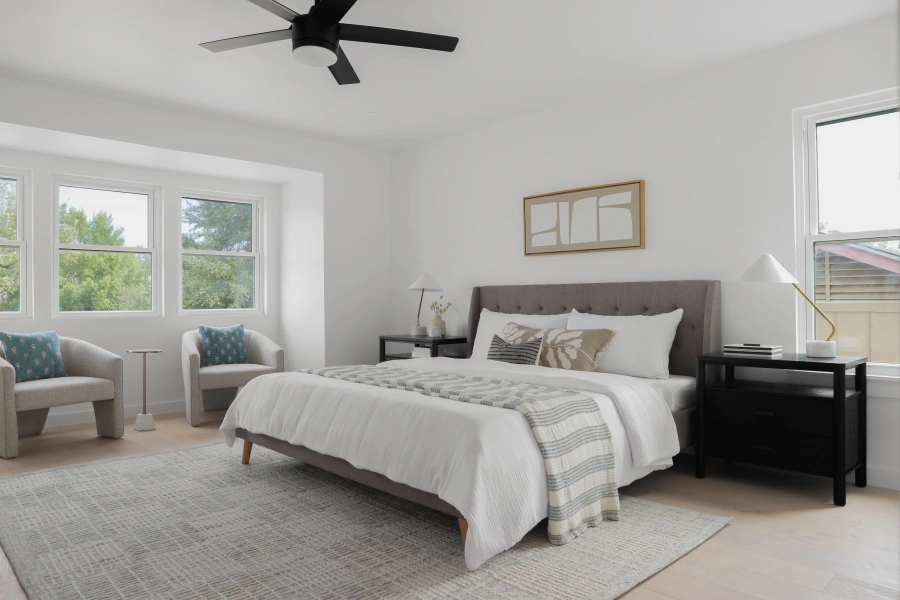 Modern bedroom with vaulted ceiling and natural light