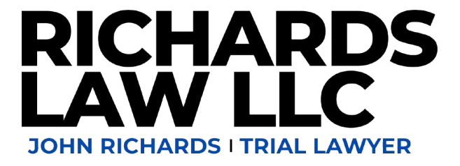 The logo for Richards Law LLC, a legal services firm led by trial lawyer John Richards. The logo features the company name in bold text with the tagline "John Richards | Trial Lawyer" below.